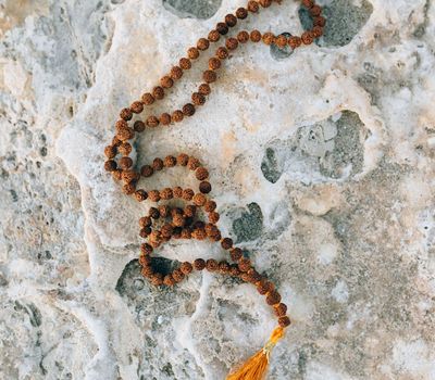 Silhouette of a person balancing on one leg at sunrise.